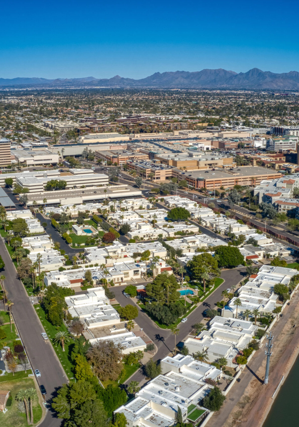 Scottsdale Aerial view of Scottsdale, Arizona, showcasing residential neighborhoods, commercial buildings, and the surrounding mountains, emphasizing the local context for Power Crew Pressure Washing's services.